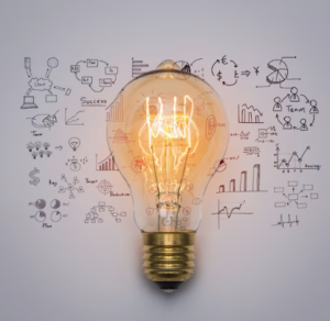 Light bulb with business strategy doodles